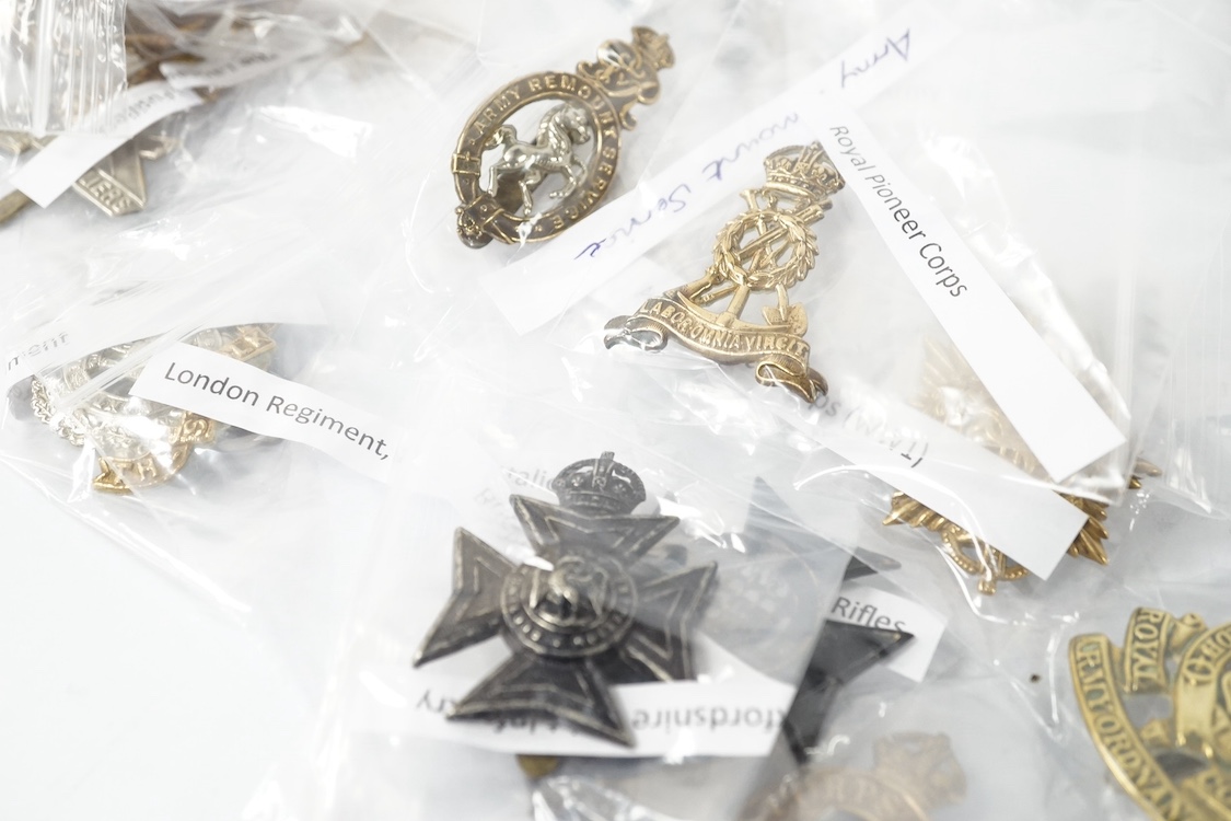 Forty military cap badges including; the 20th Hussars regiment, Royal Pioneer Corps, Army Music Corps, Women’s Army Auxiliary Corps, Army Veterinary Corps, Queen Mary’s Regiment Surrey Yeomanry, Royal East Kent regiment,